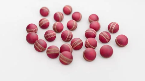 Dynamic Camera Motion Around Red Cricket Balls on Studio Floor. 4K 库存影片 334367920