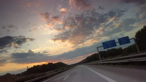 Dynamic Cardrive with dramatic Sunset Stock Footage 136637321