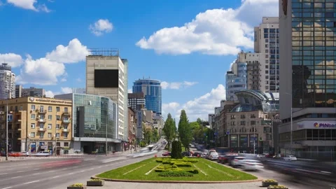 Dynamic City Pulse: Time-Lapse of Busy Traffic on Kiev's Roads in a Sunny Day Stock Footage 244386762