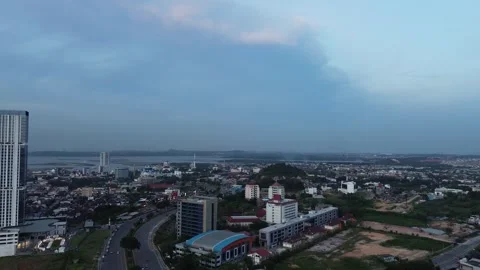 Dynamic Cityscape at Dusk Showing Modern Metropolitan City and Bay Stock Footage 320108004