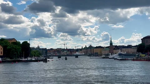 This dynamic cityscape image captures boats navigating Stock Footage 318014006