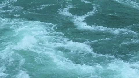 Dynamic close-up of fast-moving, turbulent water with visible rapids Stock Footage 291509111