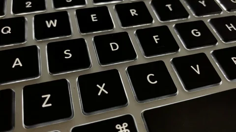 Dynamic close up on laptop key board 動画素材 100722198