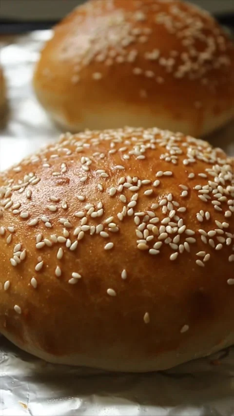 Dynamic close-up shot of fluffy hamburger buns. Stock Footage 303934660