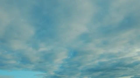 Dynamic Cloud Cover is Creating Stunning and Beautiful Patterns Over the Serene Stock Photos