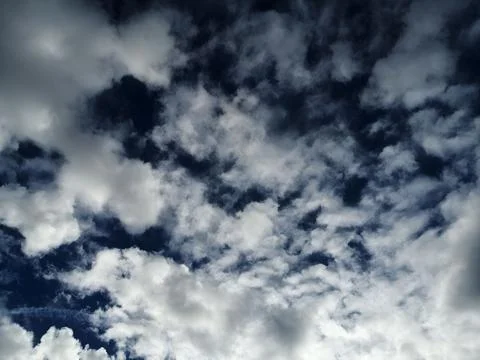 Dynamic Cloud Formation Against Dark Blue Sky Stock Photos