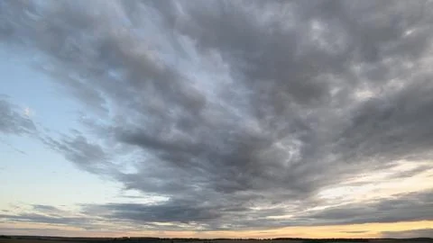 Dynamic Cloud Formation at Sunset A stunning display of natures evolving beauty Stock Photos