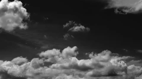 Dynamic cloud motion captured with a high-contrast black background. Stock Footage 337332720