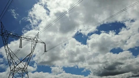 Dynamic Cloud Movement Fast Passing Over High Voltage Power Infrastructure Frami Stock-Footage 343751193