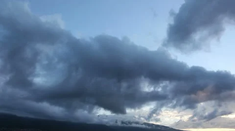 Dynamic cloud movement over a mountain in time-lapse Stock Footage 43978700