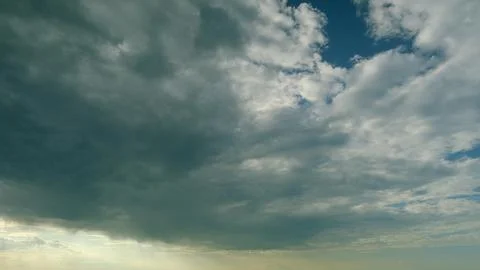 Dynamic Cloud Patterns Observed Above Us Throughout Different Times of the Day a Stock Photos