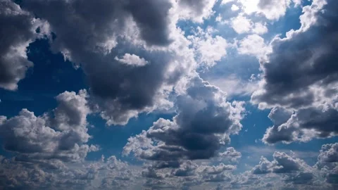 Dynamic Cloud Timelapse Across Vivid Blue Sky with Sunlight Stock Footage 310100222