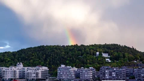 Dynamic Clouds and Double Rainbow Over Oslo Modern Builds Timelapse Video Video stock 308194106