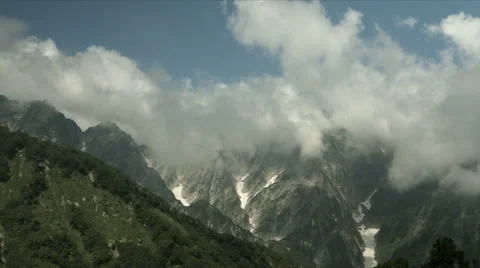 Dynamic clouds looming over mountains, flat color Stock Footage 66747370
