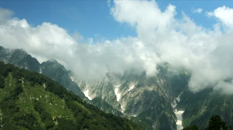 Dynamic clouds looming over mountains Stock-Footage 66747549