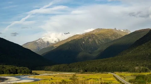 Dynamic clouds over mountains shortly before sunset, 4k Stock Footage 231931395