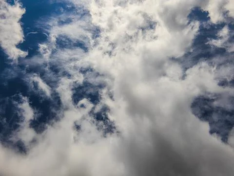 Dynamic clouds in vast blue sky over Kyrgyzstan Photos