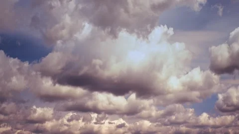Dynamic Cloudscape with Fluffy Clouds and Blue Skies Stock Footage 341373082