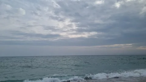 Dynamic cloudy seascape with moving ocean waves under dramatic sky Stock Footage 321651100