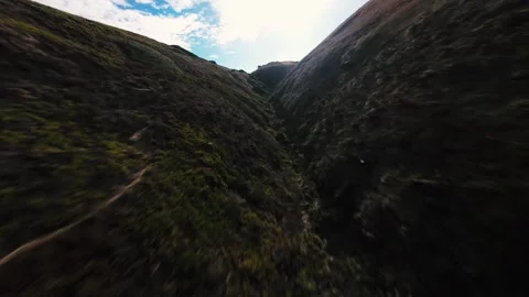 Dynamic coastal scene with foamy surf and steep cliffs Stock Footage 340905223