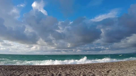 Dynamic coastline with stronger waves and darkening clouds. Antalya, Turkey Video stock 323249484