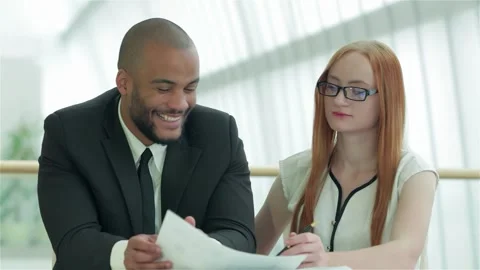 Dynamic collaboration between young professionals in a modern office Video stock 311806295