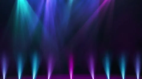 Dynamic colorful stage spotlights illuminating dark background with orange 库存影片 340612935