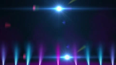 Dynamic Colorful Stage Spotlights Shining in Dark Background with Glowing Lens Stock Footage 338438770