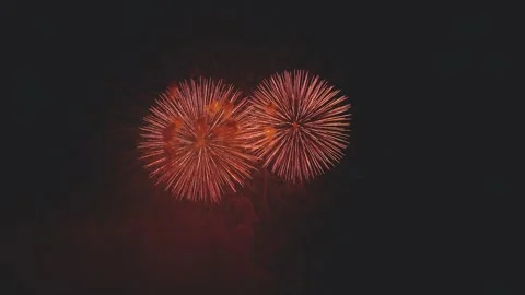 Dynamic continuous fireworks sequence illuminating dark smoke in night sky Stock Footage 340632841