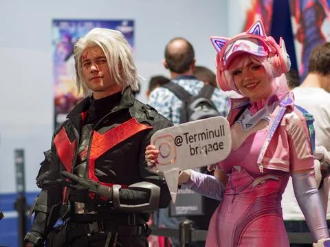 Dynamic Cosplay Duo Capturing Attention at Gaming Convention Stock Photos