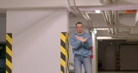 Dynamic Dance Movements Taking Place in an Urban Garage Space Stock Footage 316545779
