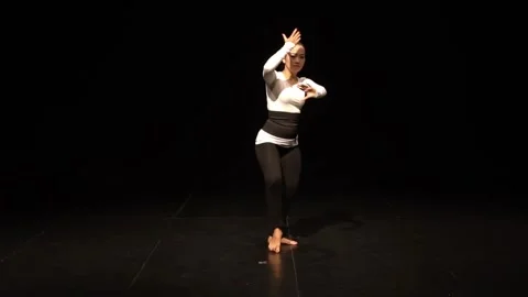 Dynamic Dance Performance in Dramatic Lighting Stock Footage 313355117
