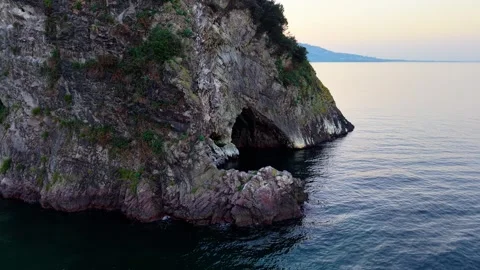 Dynamic Diagonal Aerial Shot of Hidden Entrance at Hoynat Island at Sunset Vídeo Stock 334243987