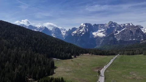 Dynamic Diagonal Flight Tracking Across Alpine Peaks and Forested Valley Stock Footage 341193074
