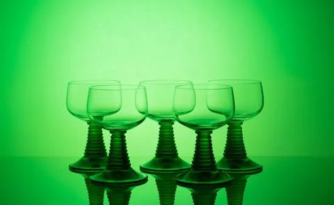 Dynamic display of glassware enhanced with vibrant colored lighting elements Stock Photos
