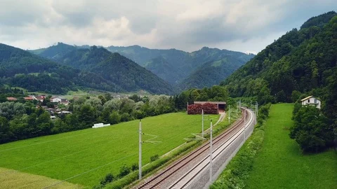 Dynamic drone 4K movement with fast train passing by Stock Footage