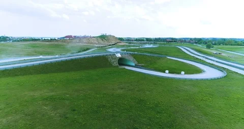 Dynamic drone dolly shot of racing car riding on racing track Video stock 89416242