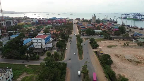 Dynamic drone footage revealing a bustling coastal city's maritime hub, urb.. Video stock 339035107