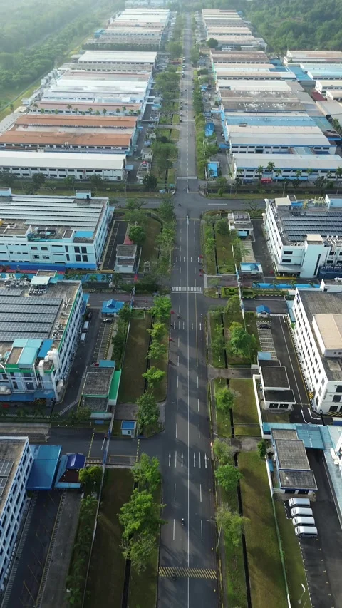 Dynamic drone footage revealing an expansive industrial zone with diverse c.. Video stock 339040146