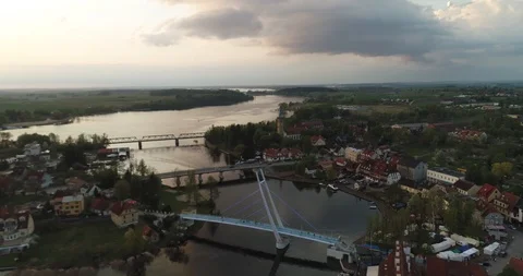 Dynamic drone shot of boat flowing to port town during sunset Stock Footage 89415953