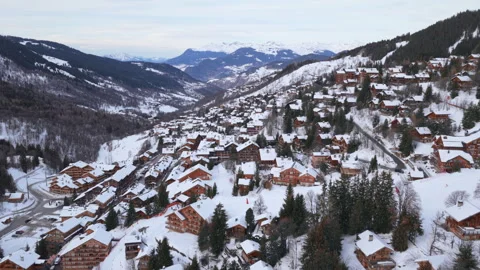 Dynamic drone shot of Meribel, a popular ski resort town in the French Alps Video stock 336701868