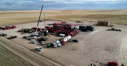 Dynamic drone shot of natural gas extraction on the plains of Eastern Stock Footage 167396547