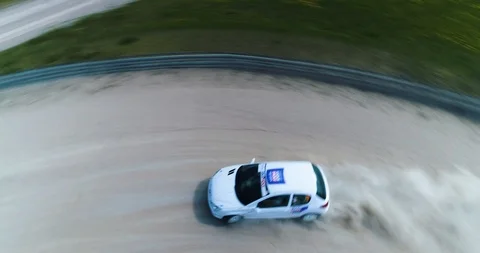 Dynamic drone shot of racing car riding in a corner. Stock Footage 89416234