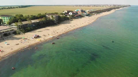 Dynamic Drone Shot of the Sea Ocean Resort With Sand Beach and Vacationers Stock-Footage 115033865