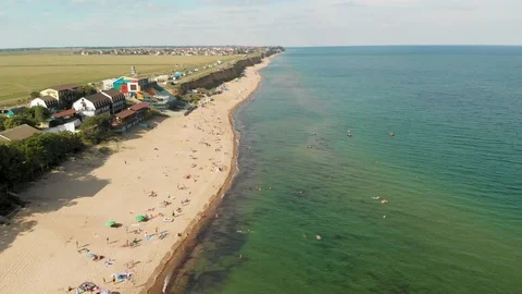 Dynamic Drone Shot of the Sea Ocean Resort With Sand Beach and Vacationers Stock-Footage 115034202