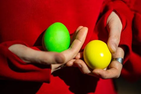 Dynamic Duality: Person Juggling Two Easter Eggs Stock Photos