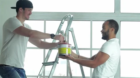 Dynamic duo transforming an apartment Stock Footage 311826331