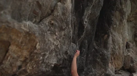 Dynamic Female Boulder Climber 4K Stock Footage 64184566