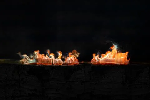 Dynamic fire flames burning with smoke creating an abstract background text.. Photos