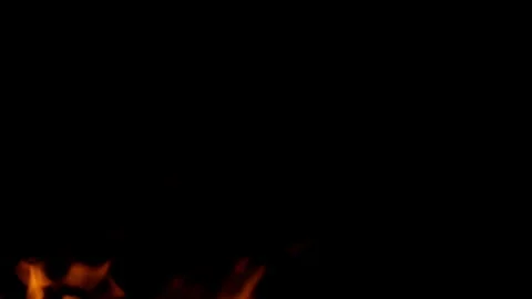 Dynamic Fire Flames Dancing Vividly Against a Dark Background, Creating a Captiv Stock Footage 311815405